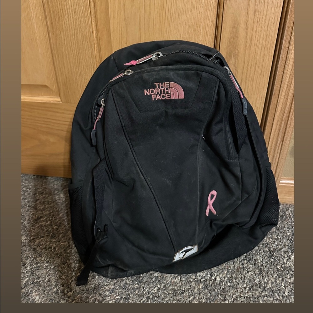 The North Face Black Backpack with Pink Details